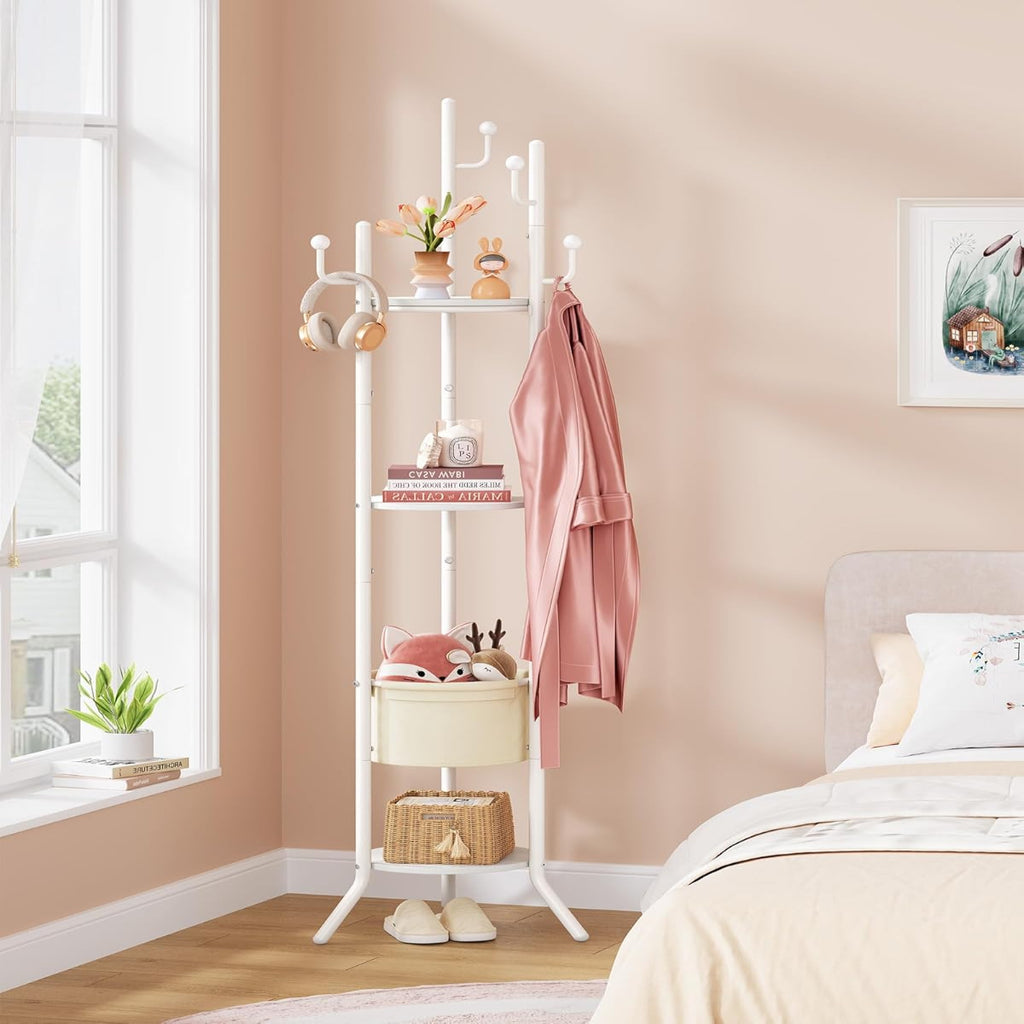 White coat rack with shelves in a bedroom setting with pink walls and a bed.