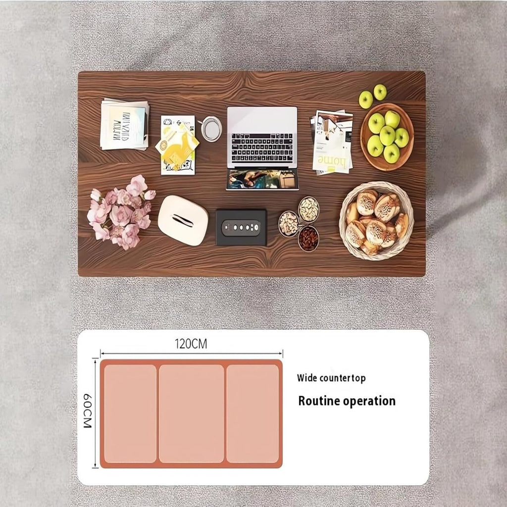 Wooden countertop with various items including a laptop, snacks, and a phone, with a size label indicating 120cm width.